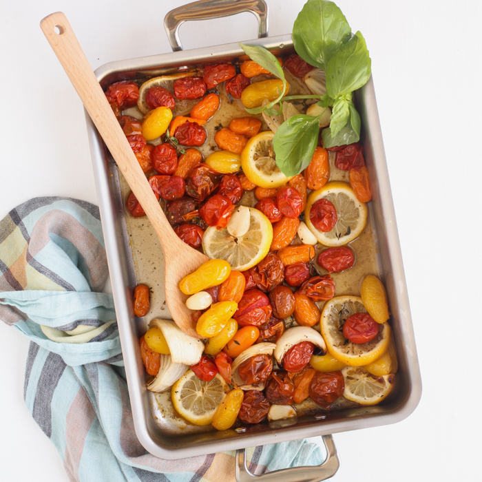 360 Cookware 9x13 inch stainless steel bake and roast pan with roasted vegetables and lemon slices inside