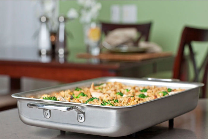 360 Cookware 9x13 inch stainless steel bake and roast pan filled with baked casserole on kitchen countertop