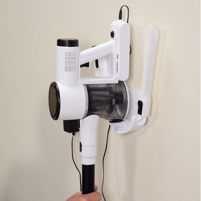 EdenPURE Bio SpeedCLEAN Cordless Vac Model VX300 white vacuum mounted on wall charger with crevice tool attached