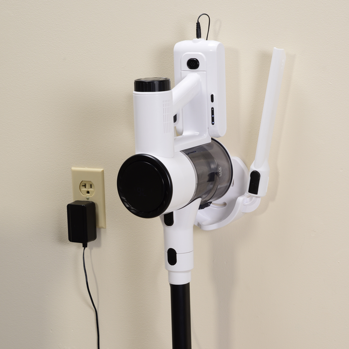 EdenPURE Bio SpeedCLEAN Cordless Vac VX300 mounted on wall charger with slim crevice tool attached and power adapter plugged in