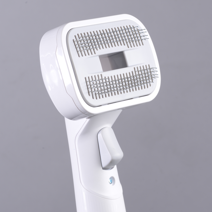 EdenPURE Bio SpeedCLEAN VX300 pet brush attachment with metal bristles and ergonomic white handle on gray background