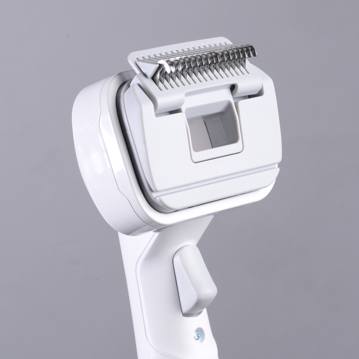 EdenPURE Bio SpeedCLEAN VX300 pet brush accessory with flexible hose and metal grooming blade close-up on gray background