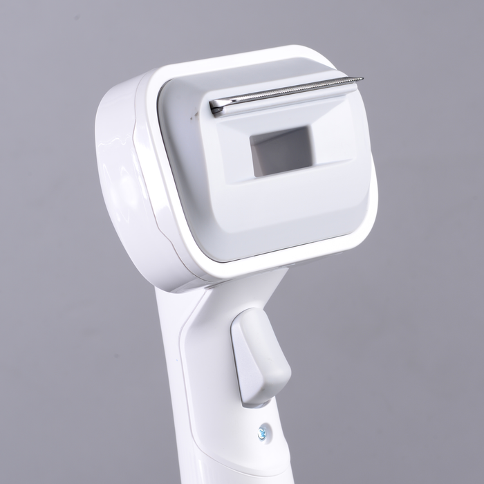 EdenPURE Bio SpeedCLEAN VX300 pet brush attachment with white plastic handle and metal grooming blade close-up