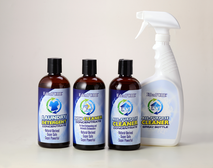 EdenPURE Natural Household Cleaner Kit with laundry detergent, dish cleaner, all-purpose cleaner concentrates, and spray bottle on white surface