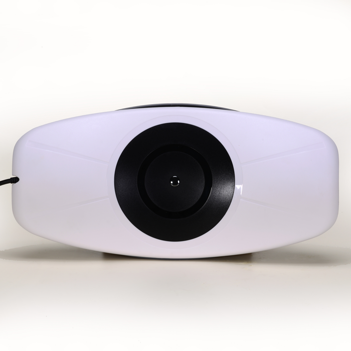 EdenPURE PainNOT Smart Back Appliance in white with black circular center and power cord on side isolated on white background