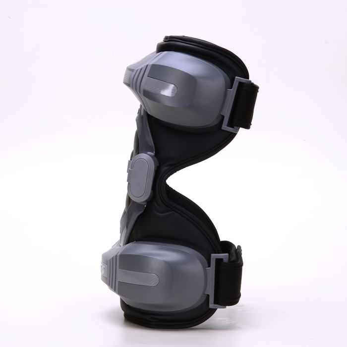 EdenPURE PainNOT Smart Joint Appliance in black with gray protective pads and adjustable straps isolated on white background