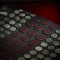 Close-up of EdenPURE TotalRELIEF Heating Pad with dark mesh covering round red and green infrared therapy stones