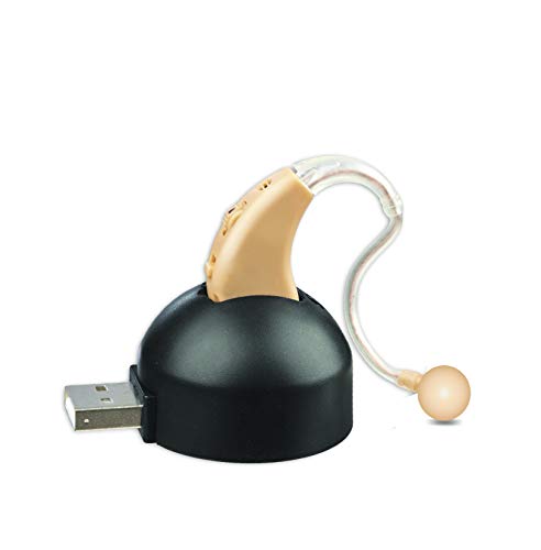 Elite Ear Nude Hearing Amplifier twin pack with beige casing and clear ear hook on black USB charging base isolated on white background