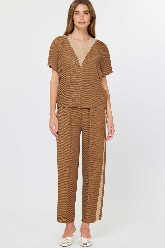 taupe colored crop pants with lighter color stripe on bottom