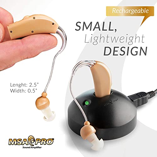 MSA Pro Nude Hearing Amplifier with small lightweight design shown held and resting on black rechargeable charging dock