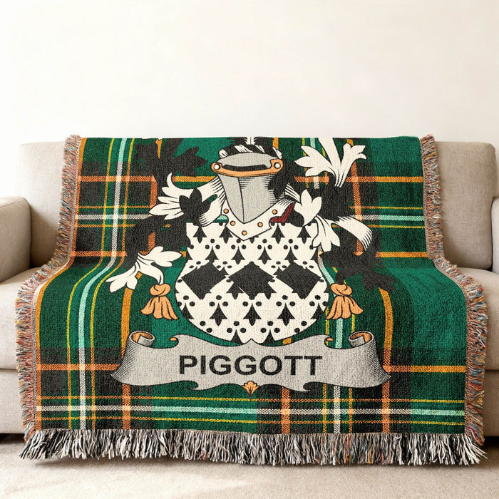 Tartan blanket with PIGGOTT family crest and shield.