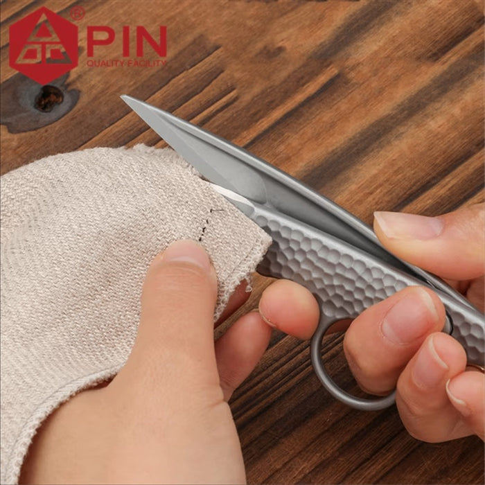 PIN-900 blade close-up cutting linen