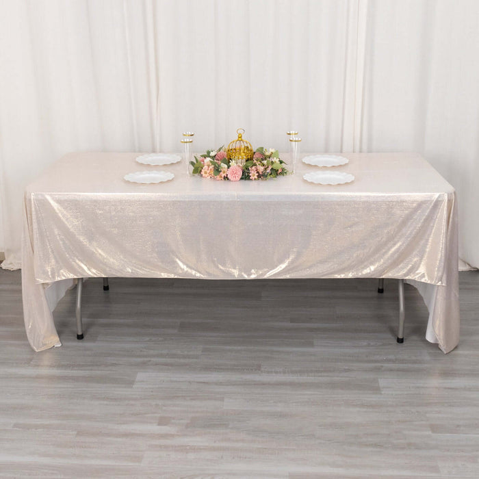 Elegant table setup with floral centerpiece and decorative plates.