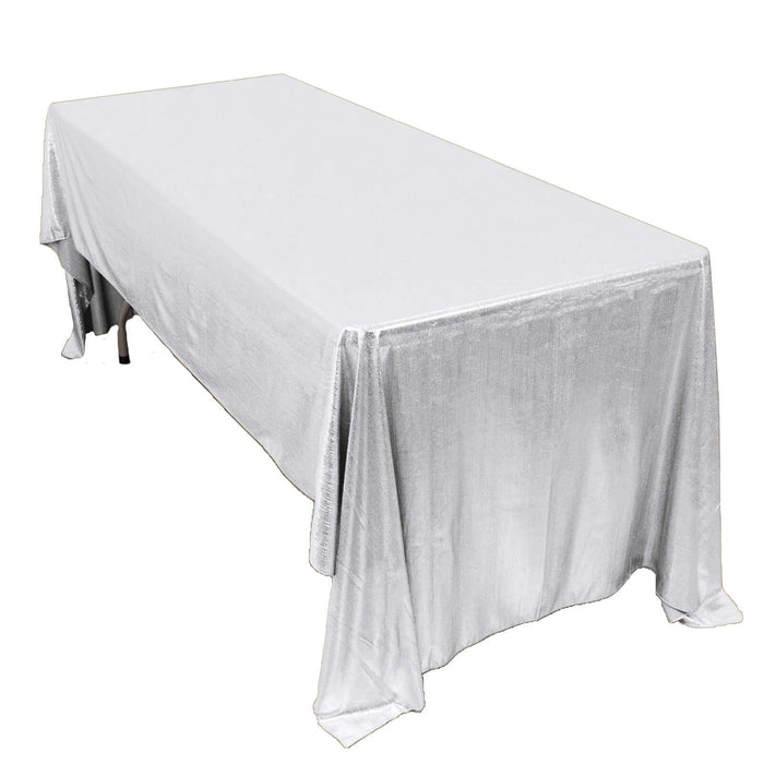 White tablecloth draped over a long table for event styling