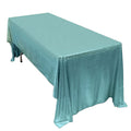 Turquoise tablecloth draped elegantly over a rectangular table