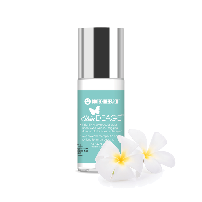 SkinDEAGE Anti-Aging Cream bottle with silver cap and white plumeria flowers on white background