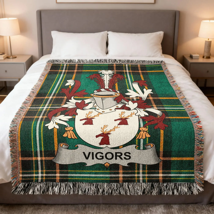 Vigors Irish family crest woven blanket displayed on a bed.