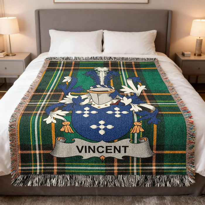 Vincent Irish family crest woven blanket displayed on a bed.