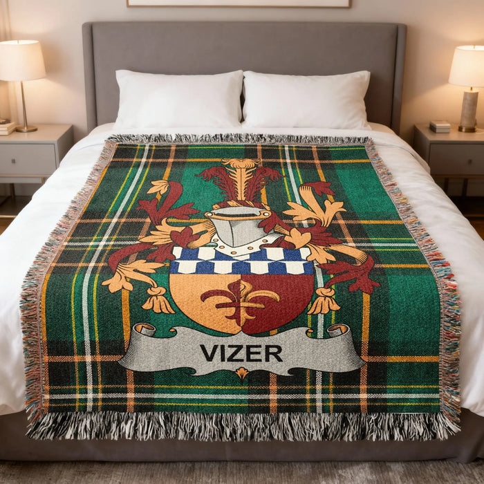 Vizer Irish family crest woven blanket displayed on a bed.