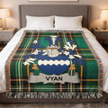 Tartan blanket with a blue and white crest and the name "Vyan".